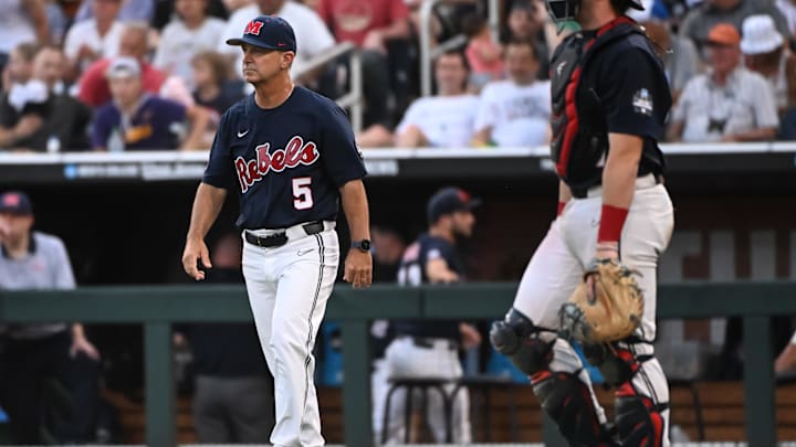 Jun 18, 2022; Omaha, NE, USA; Ole Miss Rebels head coach Mike Bianco walks to the mound in the eighth inning against the Auburn Tigers at Charles Schwab Field. Mandatory Credit: Steven Branscombe-Imagn Images Jun 18, 2022; Omaha, NE, USA; Ole Miss Rebels head coach Mike Bianco walks to the mound in the eighth inning against the Auburn Tigers at Charles Schwab Field. Mandatory Credit: Steven Branscombe-Imagn Images