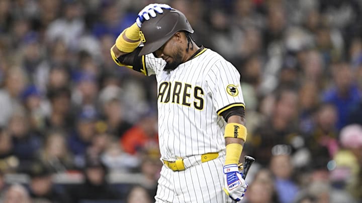 Apr 15, 2025; San Diego, California, USA; San Diego Padres first baseman Luis Arraez (4) reacts after striking out during the fifth inning against the Chicago Cubs at Petco Park. Mandatory Credit: Denis Poroy-Imagn Images