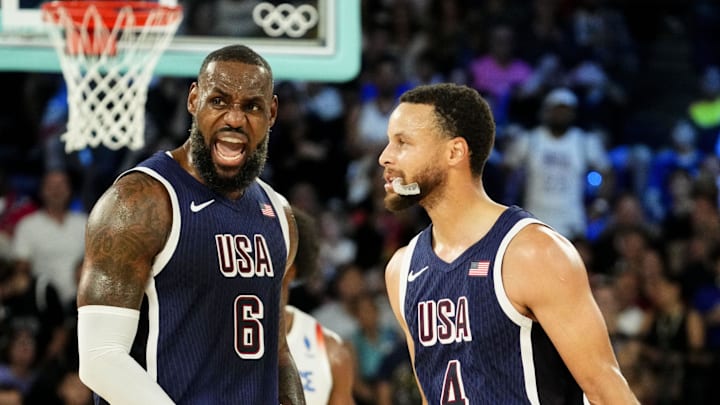 Aug 10, 2024; Paris, France; United States forward LeBron James (6) and United States shooting guard Stephen Curry (4) in the men's basketball gold medal game during the Paris 2024 Olympic Summer Games at Accor Arena. 