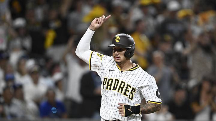 Aug 23, 2025; San Diego, California, USA; San Diego Padres third baseman Manny Machado (13) celebrates as he scores during the eighth inning against the Los Angeles Dodgers at Petco Park. Mandatory Credit: Denis Poroy-Imagn Images Aug 23, 2025; San Diego, California, USA; San Diego Padres third baseman Manny Machado (13) celebrates as he scores during the eighth inning against the Los Angeles Dodgers at Petco Park. Mandatory Credit: Denis Poroy-Imagn Images