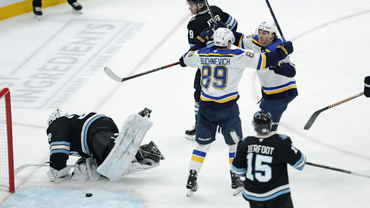 Feb 2, 2025; Salt Lake City, Utah, USA; St. Louis Blues center Jordan Kyrou (25) and left wing Pavel Buchnevich (89) celebrate a Blues goal against the Utah Hockey Club during the third period at Delta Center. Mandatory Credit: Chris Nicoll-Imagn Images