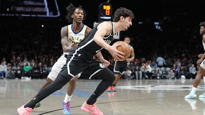 Apr 9, 2026; Brooklyn, New York, USA; Brooklyn Nets guard Ben Saraf (77) dribbles the ball against Indiana Pacers guard Quenton Jackson (29) during the first half at Barclays Center. Mandatory Credit: Gregory Fisher-Imagn Images