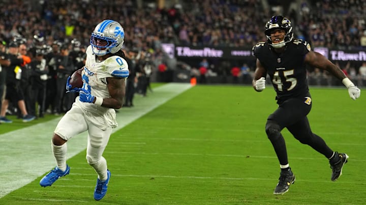 Sep 22, 2025; Baltimore, Maryland, USA; Detroit Lions running back Jahmyr Gibbs (0) rushes for a touchdown past Baltimore Ravens linebacker Mike Green (45) during the second half at M&T Bank Stadium. Mandatory Credit: Mitch Stringer-Imagn Images