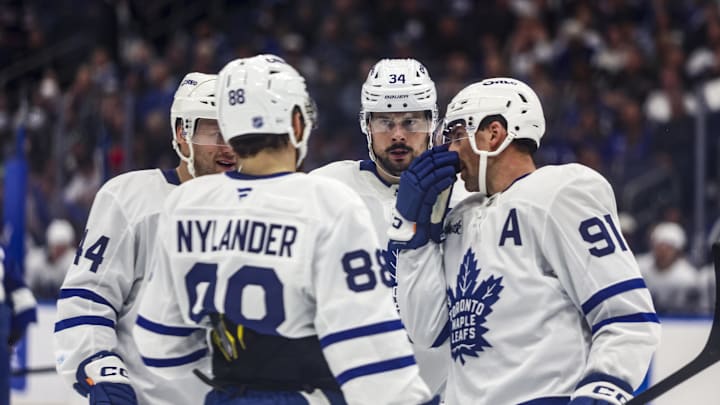Feb 25, 2026; Tampa, Florida, USA; Toronto Maple Leafs forward Auston Matthews (34), defenseman Morgan Rielly (44), forward William Nylander (88), and forward John Tavares (91) huddle before a face-off against the Tampa Bay Lightning during the second period at Benchmark International Arena. Mandatory Credit: Morgan Tencza-Imagn Images