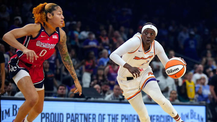Mercury guard Kahleah Copper (2) drives against Mystics center Shakira Austin (0) during a game at the Footprint Center in Phoenix on Thursday, May 23, 2024.