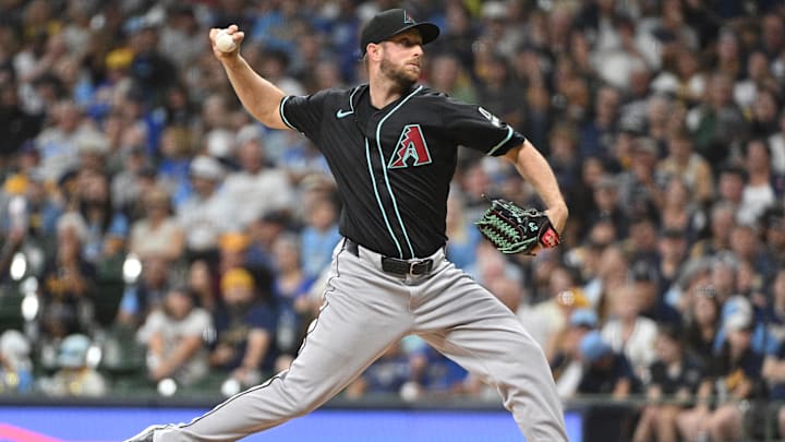 Sep 21, 2024; Milwaukee, Wisconsin, USA; Arizona Diamondbacks pitcher Merrill Kelly (29) delivers a pitch against the Milwaukee Brewers in the first inning at American Family Field. Mandatory Credit: Michael McLoone-Imagn Images