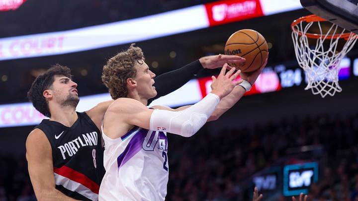 Oct 29, 2025; Salt Lake City, Utah, USA; Utah Jazz forward Lauri Markkanen (23) lays the ball up and is fouled by Portland Trail Blazers forward Deni Avdija (8) during the second half at Delta Center. Mandatory Credit: Rob Gray-Imagn Images