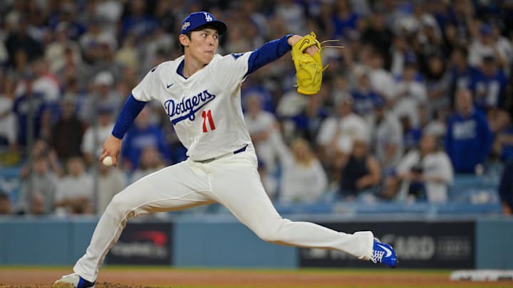 Oct 1, 2025; Los Angeles, California, USA; Los Angeles Dodgers pitcher Roki Sasaki (11) throws a pitch against the Cincinnati Reds in the ninth inning during game two of the Wildcard round for the 2025 MLB playoffs at Dodger Stadium. Mandatory Credit: Jayne Kamin-Oncea-Imagn Images