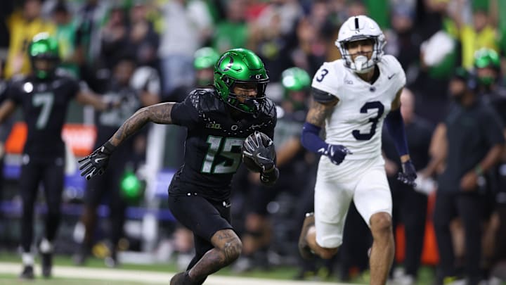 Oregon Ducks wide receiver Tez Johnson (15) runs for a gain during the fourth quarter against the Penn State Nittany Lions in the 2024 Big Ten Championship game at Lucas Oil Stadium.