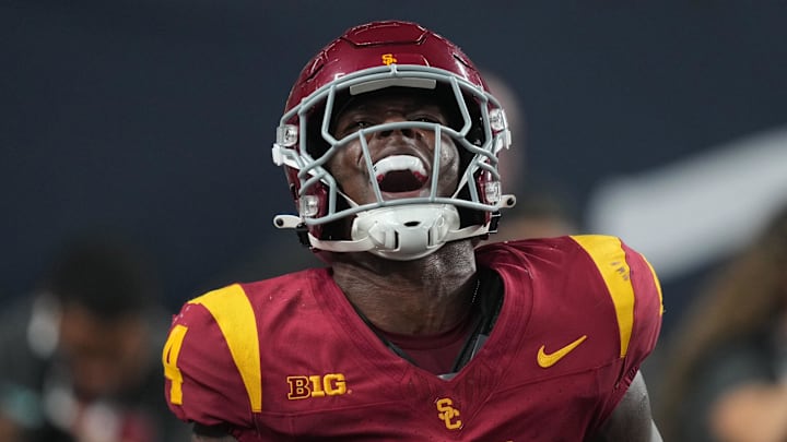 Sep 1, 2024; Paradise, Nevada, USA; Southern California Trojans running back Woody Marks (4) celebrates after scoring on a 13-yard touchdown run with eight seconds left against the LSU Tigers at Allegiant Stadium. Mandatory Credit: Kirby Lee-Imagn Images Sep 1, 2024; Paradise, Nevada, USA; Southern California Trojans running back Woody Marks (4) celebrates after scoring on a 13-yard touchdown run with eight seconds left against the LSU Tigers at Allegiant Stadium. Mandatory Credit: Kirby Lee-Imagn Images