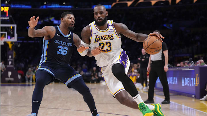 Dec 15, 2024; Los Angeles, California, USA; Los Angeles Lakers forward LeBron James (23) dribbles the ball against Memphis Grizzlies guard Marcus Smart (36) at Crypto.com Arena. Mandatory Credit: Kirby Lee-Imagn Images Dec 15, 2024; Los Angeles, California, USA; Los Angeles Lakers forward LeBron James (23) dribbles the ball against Memphis Grizzlies guard Marcus Smart (36) at Crypto.com Arena. Mandatory Credit: Kirby Lee-Imagn Images