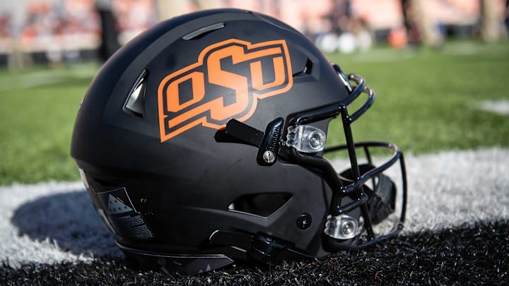 Nov 16, 2019; Stillwater, OK, USA; General view of an Oklahoma State Cowboys helmet resting on the field before the game against the Kansas Jayhawks at Boone Pickens Stadium. Mandatory Credit: Rob Ferguson-Imagn Images