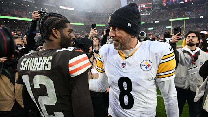 Dec 28, 2025; Cleveland, Ohio, USA; Pittsburgh Steelers quarterback Aaron Rodgers (8) and Cleveland Browns quarterback Shedeur Sanders (12) hug after the game at Huntington Bank Field. Mandatory Credit: Ken Blaze-Imagn Images