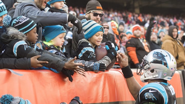 Dec 9, 2018; Cleveland, OH, USA; Carolina Panthers quarterback Cam Newton (1) gives the football to a fan after a touchdown run by running back Christian McCaffrey (not pictured) during the first half against the Cleveland Browns at FirstEnergy Stadium. Dec 9, 2018; Cleveland, OH, USA; Carolina Panthers quarterback Cam Newton (1) gives the football to a fan after a touchdown run by running back Christian McCaffrey (not pictured) during the first half against the Cleveland Browns at FirstEnergy Stadium.