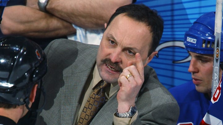 Bryan Trottier argues with the referee