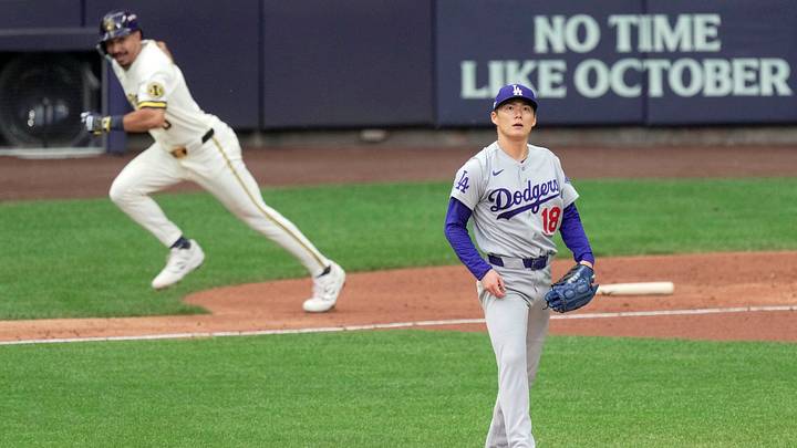 Los Angeles Dodgers pitcher Yoshinobu Yamamoto (18) watches a single hit by Milwaukee Brewers third baseman David Hamilton (6) during the third inning of their National League Championship Series game at American Family Field on Oct 12, 2026. Los Angeles Dodgers pitcher Yoshinobu Yamamoto (18) watches a single hit by Milwaukee Brewers third baseman David Hamilton (6) during the third inning of their National League Championship Series game at American Family Field on Oct 12, 2026.