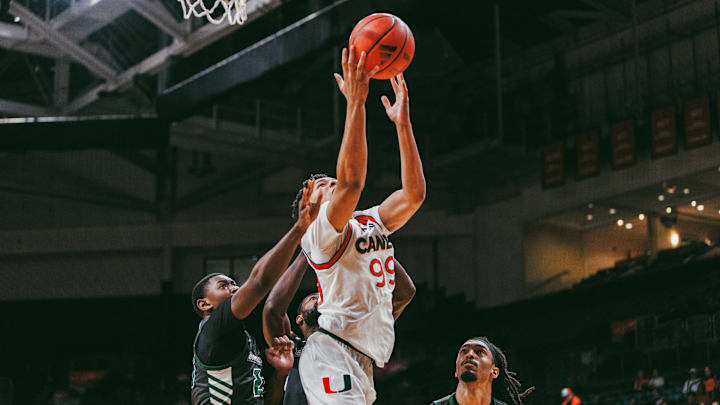 Freshman Divine Ugochukwu (99) laying the ball up against Binghamton
