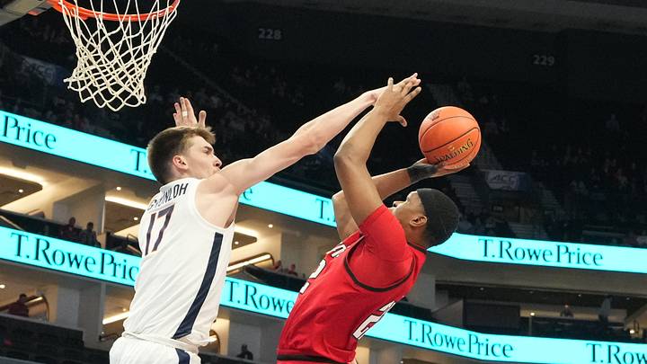 Mar 12, 2026; Charlotte, NC, USA; NC State Wolfpack forward Ven-Allen Lubin (22) shoots as Virginia Cavaliers center Johann Grünloh (17) defends in the first half at Spectrum Center. Mandatory Credit: Bob Donnan-Imagn Images Mar 12, 2026; Charlotte, NC, USA; NC State Wolfpack forward Ven-Allen Lubin (22) shoots as Virginia Cavaliers center Johann Grünloh (17) defends in the first half at Spectrum Center. Mandatory Credit: Bob Donnan-Imagn Images