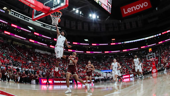 North Carolina State Wolfpack guard Paul McNeil (2) dunks on Boston College Eagles forward Chad Venning (32) during the first half of the game at Lenovo Center.