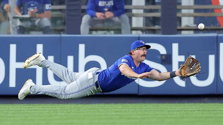 May 18, 2026; Bronx, New York, USA; Toronto Blue Jays left fielder Davis Schneider (36) dives but cannot catch a double by New York Yankees shortstop Anthony Volpe (not pictured) during the fourth inning at Yankee Stadium. Mandatory Credit: Brad Penner-Imagn Images