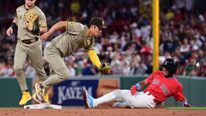 Jun 28, 2024; Boston, Massachusetts, USA; San Diego Padres shortstop Ha-Seong Kim (7) tags Boston Red Sox shortstop Ceddanne Rafaela (43) out during the seventh inning at Fenway Park.