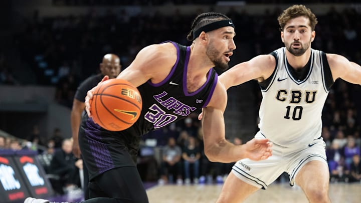 GCU forward Gabe McGlothan (30) dribbles the ball up court at Grand Canyon University Arena in