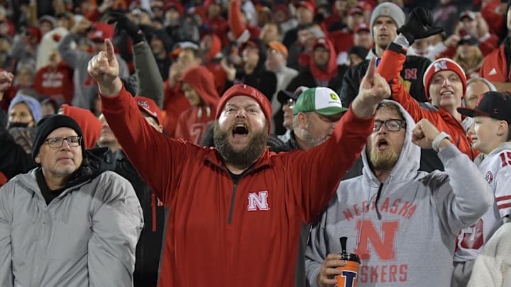 Oct 6, 2023; Champaign, Illinois, USA; Nebraska Cornhuskers fans cheer during the second half against the Illinois Fighting Illini at Memorial Stadium. Mandatory Credit: Ron Johnson-Imagn Images Oct 6, 2023; Champaign, Illinois, USA; Nebraska Cornhuskers fans cheer during the second half against the Illinois Fighting Illini at Memorial Stadium. Mandatory Credit: Ron Johnson-Imagn Images