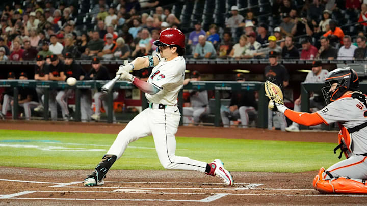 Arizona Diamondbacks Corbin Carroll (7) hits a single against the San Francisco Giants in the first inning at Chase Field in Phoenix on Sept. 25, 2024. Arizona Diamondbacks Corbin Carroll (7) hits a single against the San Francisco Giants in the first inning at Chase Field in Phoenix on Sept. 25, 2024.