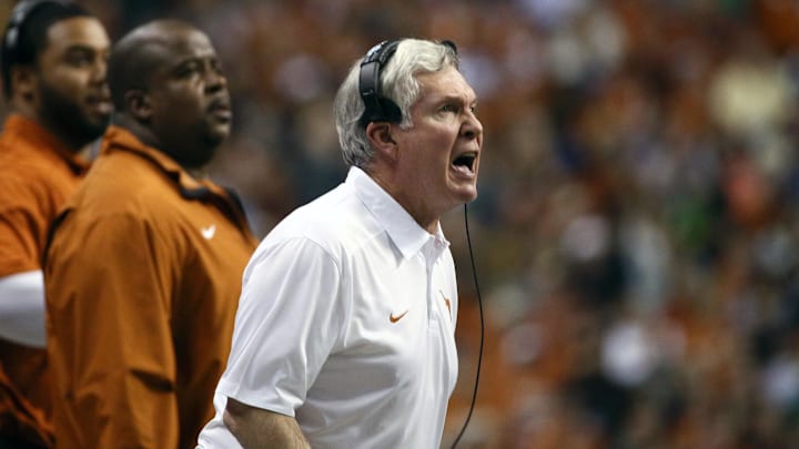 Dec 30, 2013; San Antonio, TX, USA; Texas Longhorns head coach Mack Brown reacts on the sidelines during the second half against Oregon Ducks at Alamo Dome. Oregon defeated Texas 30-7. Mandatory Credit: Soobum Im-Imagn Images