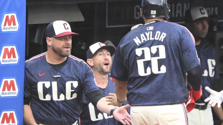 Jun 4, 2024; Cleveland, Ohio, USA; Cleveland Guardians first baseman Josh Naylor (22) celebrates his two-run home run with manager Stephen Vogt (12) in the fourth inning against the Kansas City Royals at Progressive Field. Mandatory Credit: David Richard-USA TODAY Sports