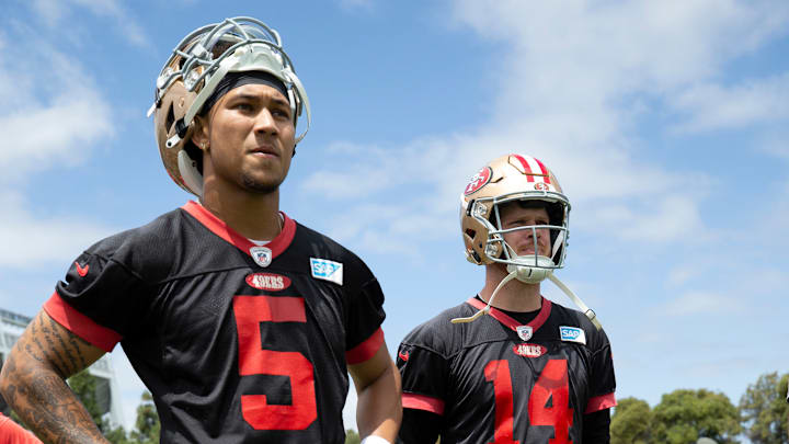 San Francisco 49ers quarterbacks Trey Lance (L) and Sam Darnold (R)