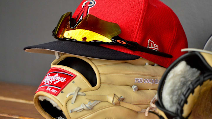 Mar 6, 2019; Salt River Pima-Maricopa, AZ, USA; General view of a Los Angeles Angels hat, glasses and glove during the game against the Colorado Rockies at Salt River Fields at Talking Stick. Mandatory Credit: Matt Kartozian-Imagn Images Mar 6, 2019; Salt River Pima-Maricopa, AZ, USA; General view of a Los Angeles Angels hat, glasses and glove during the game against the Colorado Rockies at Salt River Fields at Talking Stick. Mandatory Credit: Matt Kartozian-Imagn Images