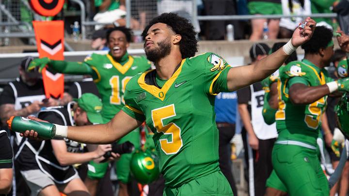 Oregon quarterback Dante Moore dances to the song “Shout” during a timeout at Autzen.