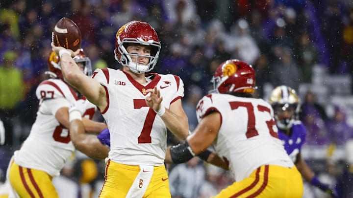 Nov 2, 2024; Seattle, Washington, USA; USC Trojans quarterback Miller Moss (7) passes against the Washington Huskies during the second quarter at Alaska Airlines Field at Husky Stadium. 