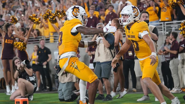 Arizona State quarterback Sam Leavitt (10) celebrates his touchdown run with teammate Jordyn Tyson (0) Jordyn Tyson against the Mississippi State Bulldogs at Mountain America Stadium in Tempe on Sept. 7, 2024.