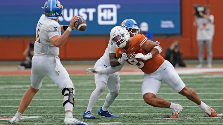 Texas Longhorns linebacker Trey Moore rushes San Jose State Spartans quarterback Walker Eget during the second half 