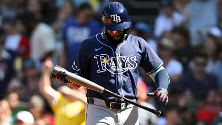 Jul 13, 2025; Boston, Massachusetts, USA; Tampa Bay Rays third base Junior Caminero (13) walks off of the field after striking out against the Boston Red Sox during the eighth inning  at Fenway Park.