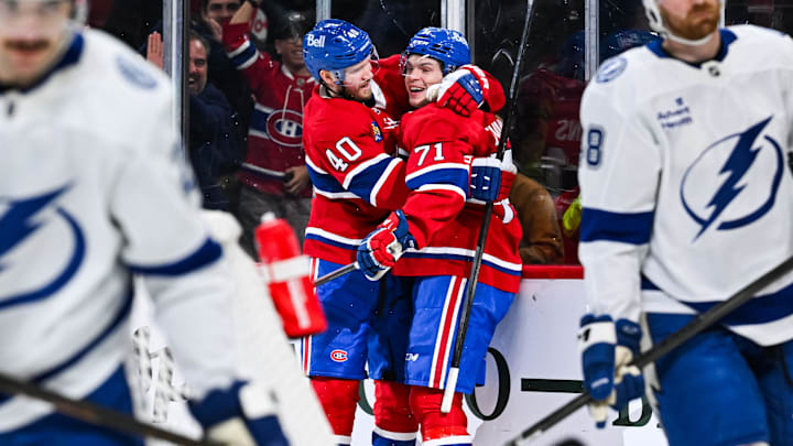 Jan 21, 2025; Montreal, Quebec, CAN; Montreal Canadiens center Jake Evans (71) celebrates with right wing Joel Armia (40) after his game winning goal during the third period against the Tampa Bay Lightning at Bell Centre. Mandatory Credit: David Kirouac-Imagn Images