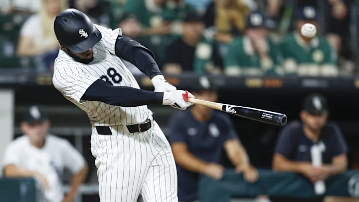 Sep 14, 2024; Chicago, Illinois, USA; Chicago White Sox outfielder Luis Robert Jr. (88) singles against the Oakland Athletics during the seventh inning at Guaranteed Rate Field.