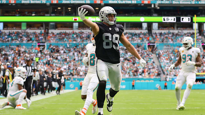 Nov 17, 2024; Miami Gardens, Florida, USA; Las Vegas Raiders tight end Brock Bowers (89) runs with the football for a touchdown against the Miami Dolphins during the third quarter at Hard Rock Stadium. Mandatory Credit: Sam Navarro-Imagn Images