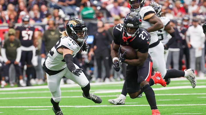 Nov 9, 2025; Houston, Texas, USA; Houston Texans running back Woody Marks (27) rushes against Jacksonville Jaguars safety Andrew Wingard (42) in the first half at NRG Stadium. Mandatory Credit: Thomas Shea-Imagn Images Nov 9, 2025; Houston, Texas, USA; Houston Texans running back Woody Marks (27) rushes against Jacksonville Jaguars safety Andrew Wingard (42) in the first half at NRG Stadium. Mandatory Credit: Thomas Shea-Imagn Images