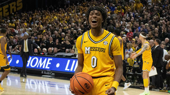 Dec 8, 2024; Columbia, Missouri, USA; Missouri Tigers guard Anthony Robinson II (0) celebrates as the clock hits zero in their win over the Kansas Jayhawks at Mizzou Arena.
