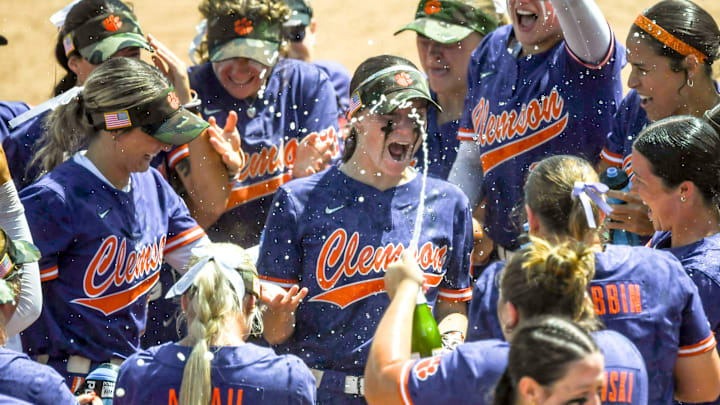 Clemson douse each other with water and sparking juice after winning the NCAA Softball Clemson Regional, a 5-1 win against Kentucky at McWhorter Stadium in Clemson Sunday, May 18, 2025.
