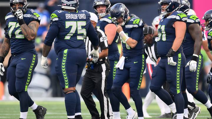 Sep 9, 2026; Seattle, Washington, USA; Seattle Seahawks quarterback Sam Darnold (14) reacts after being sacked during the first quarter against the New England Patriots at Lumen Field. Mandatory Credit: Steven Bisig-Imagn Images Sep 9, 2026; Seattle, Washington, USA; Seattle Seahawks quarterback Sam Darnold (14) reacts after being sacked during the first quarter against the New England Patriots at Lumen Field. Mandatory Credit: Steven Bisig-Imagn Images