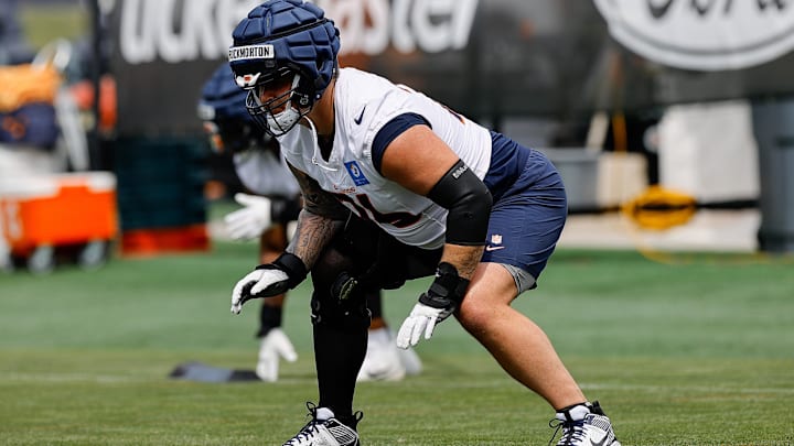 Jul 26, 2024; Englewood, CO, USA; Denver Broncos guard Calvin Throckmorton (76) during training camp at Broncos Park Powered by CommonSpirit. Mandatory Credit: Isaiah J. Downing-Imagn Images