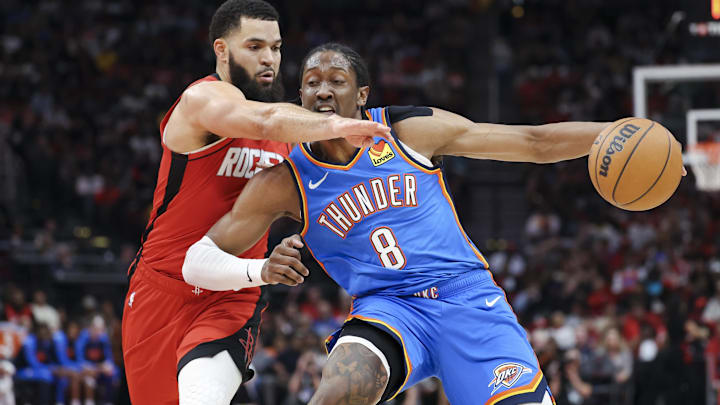 Dec 1, 2024; Houston, Texas, USA; Houston Rockets guard Fred VanVleet (5) defends as Oklahoma City Thunder forward Jalen Williams (8) controls the ball during the second quarter at Toyota Center. Mandatory Credit: Troy Taormina-Imagn Images