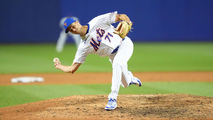 Tyler Rogers throwing a pitch against the Mariner Tyler Rogers throwing a pitch against the Mariner