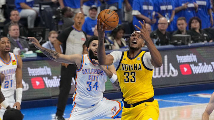 Jun 16, 2025; Oklahoma City, Oklahoma, USA; Oklahoma City Thunder forward Kenrich Williams (34) and Indiana Pacers center Myles Turner (33) battle for the loose ball during the second quarter in game five of the 2025 NBA Finals at Paycom Center. Mandatory Credit: Kyle Terada-Imagn Images