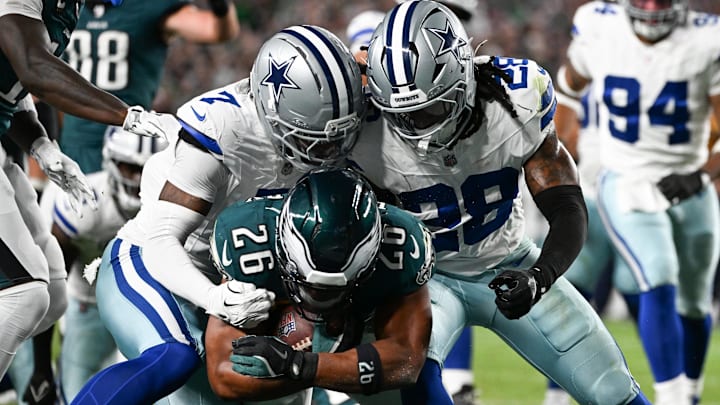 Philadelphia Eagles RB Saquon Barkley runs a touchdown defended by Dallas Cowboys CB Trevon Diggs and S Malik Hooker.