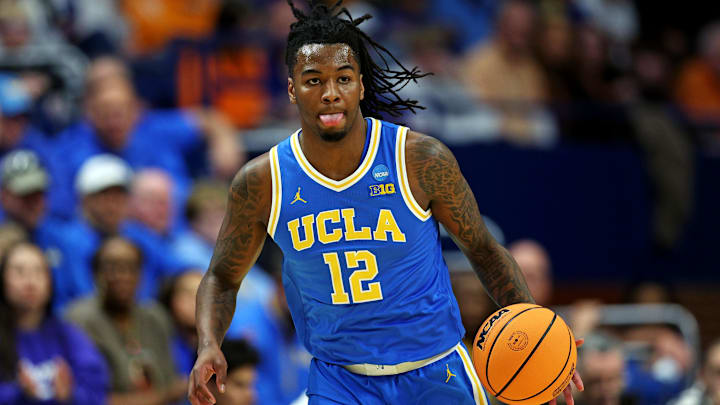 Mar 22, 2025; Lexington, KY, USA; UCLA Bruins guard Sebastian Mack (12) brings the ball up court during the first half against the Tennessee Volunteers in the second round of the NCAA Tournament at Rupp Arena. Mandatory Credit: Jordan Prather-Imagn Images